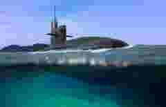 Naval submarine half submerged in shallow water