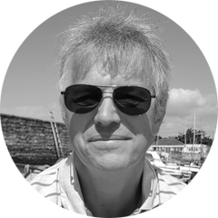 Black and white portrait, with rounded image, of Ryan Young, Engineering Manager of OEM Sensors at HBK. Ryan is one of the experts for the OEM Solution Day 2023, which take place on the 21st and 22nd of March at the HBK in Darmstadt, Germany
