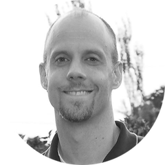 Black and white portrait, with rounded image, of Ryan Young, Engineering Manager of OEM Sensors at HBK. Ryan is one of the experts for the OEM Solution Day 2023, which take place on the 21st and 22nd of March at the HBK in Darmstadt, Germany