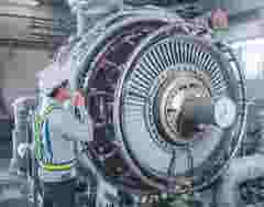 Engineer working with Gas turbine at industrial zone, Workers inspect turbine in power station, Power plant equipment, Worker checks turbine impeller vanes on factory
