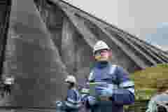 Worker at dam base
