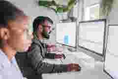 Software engineers analyzing data trends
