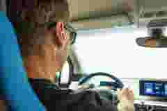 E drive vehicles man sitting in his electric vehicle