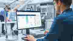 Engineer Working on Desktop Computer, Screen showing ReliaSoft  Cloud