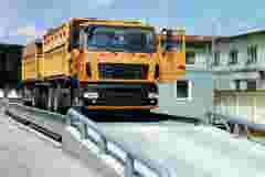 orange truck on an industrial scale with HBK weighing sensors