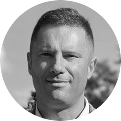 Black and white portrait, with rounded image, of Ryan Young, Engineering Manager of OEM Sensors at HBK. Ryan is one of the experts for the OEM Solution Day 2023, which take place on the 21st and 22nd of March at the HBK in Darmstadt, Germany