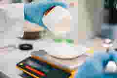Close up of scientist measuring chemicals on a scale 1