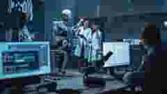 Engineers and scientists work on prototype bionics exoskeleton with people