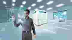From Component to Vehicle Energy Management. Engineer writing graphics on a transparent wall with an electric power cube charging cars, helicopters, electricity poles, wind turbines and nuclear power