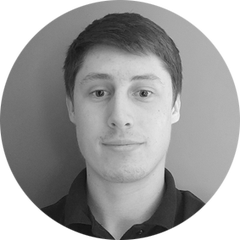 Black and white portrait, with rounded image, of Ryan Young, Engineering Manager of OEM Sensors at HBK. Ryan is one of the experts for the OEM Solution Day 2023, which take place on the 21st and 22nd of March at the HBK in Darmstadt, Germany
