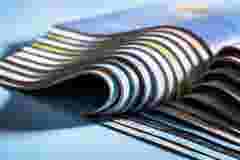 Magazine, brochure or catalogue end on against blue background