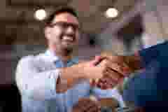 Business people shaking hands.