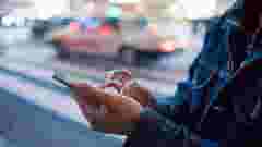 A man using his mobile phone close up