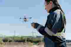 Farmer is spraying fertilizers with drones