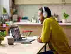 Man with headphones working from home