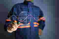 Electronic engineer use a magnifying glass expand sine wave to analyze operations for research and find the root cause of problem