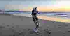 THEMIS Humanoid Robot by Westwood Robotics walking along the beach