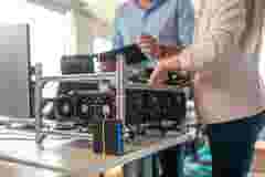 Software engineers working on hardware