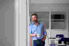 colleague with HBK coffee cup