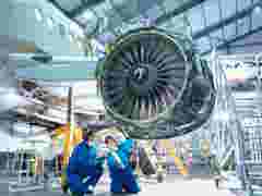 aerospace engineers are doing maintanance on jet engine
