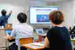 Mid adult woman in a continuing education class at a community college or university in Japan